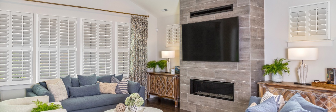 Plantation shutters in Weber County family room with fireplace